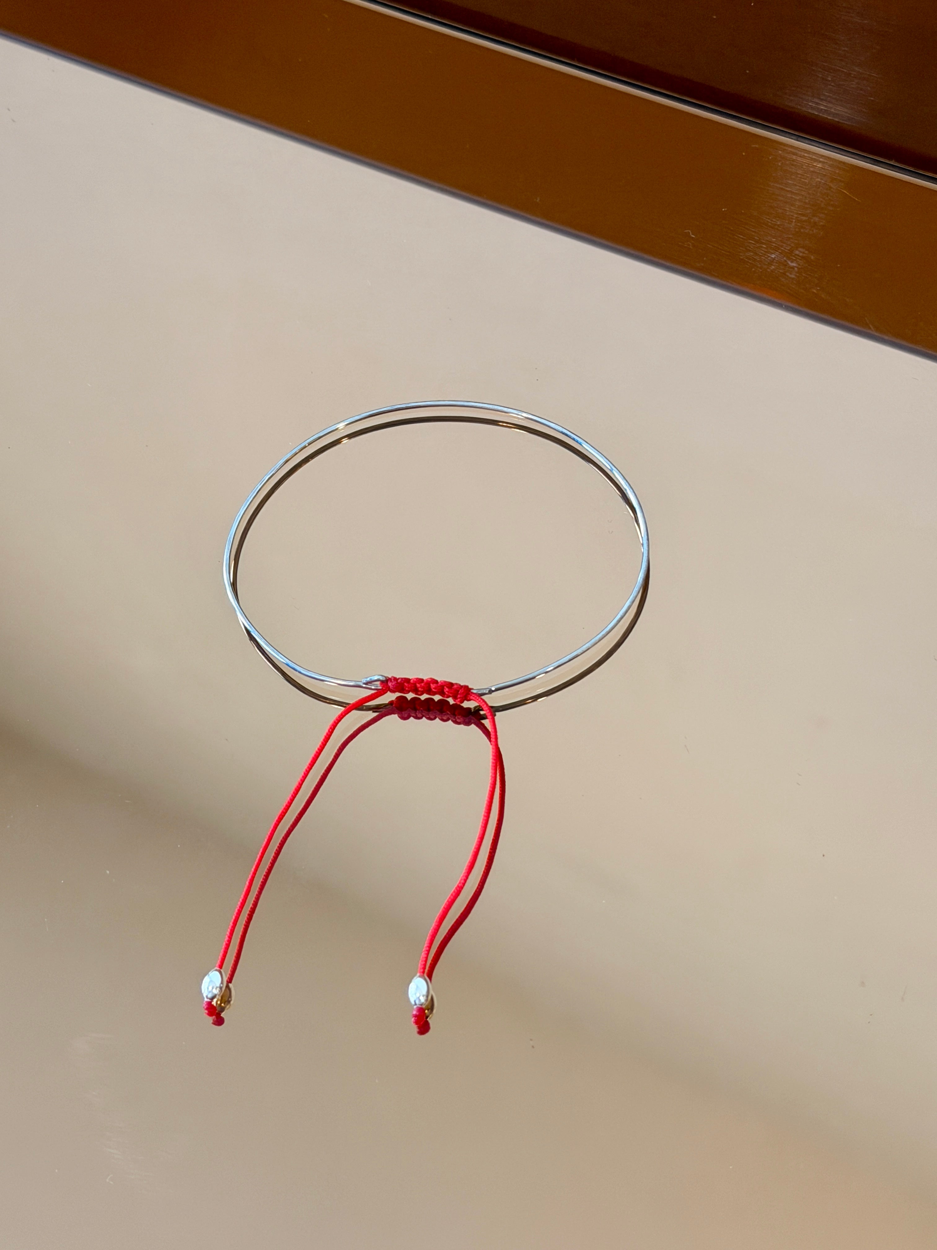 Thin Silver Bracelet with Knotted Accent