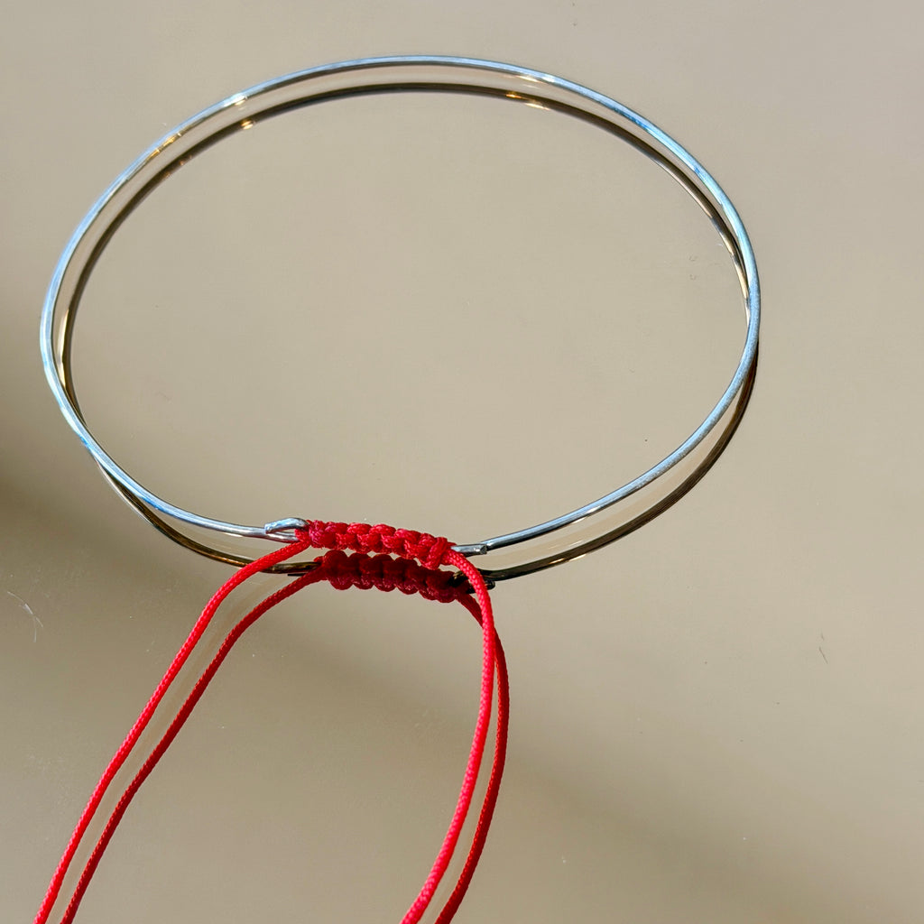 Thin Silver Bracelet with Knotted Accent