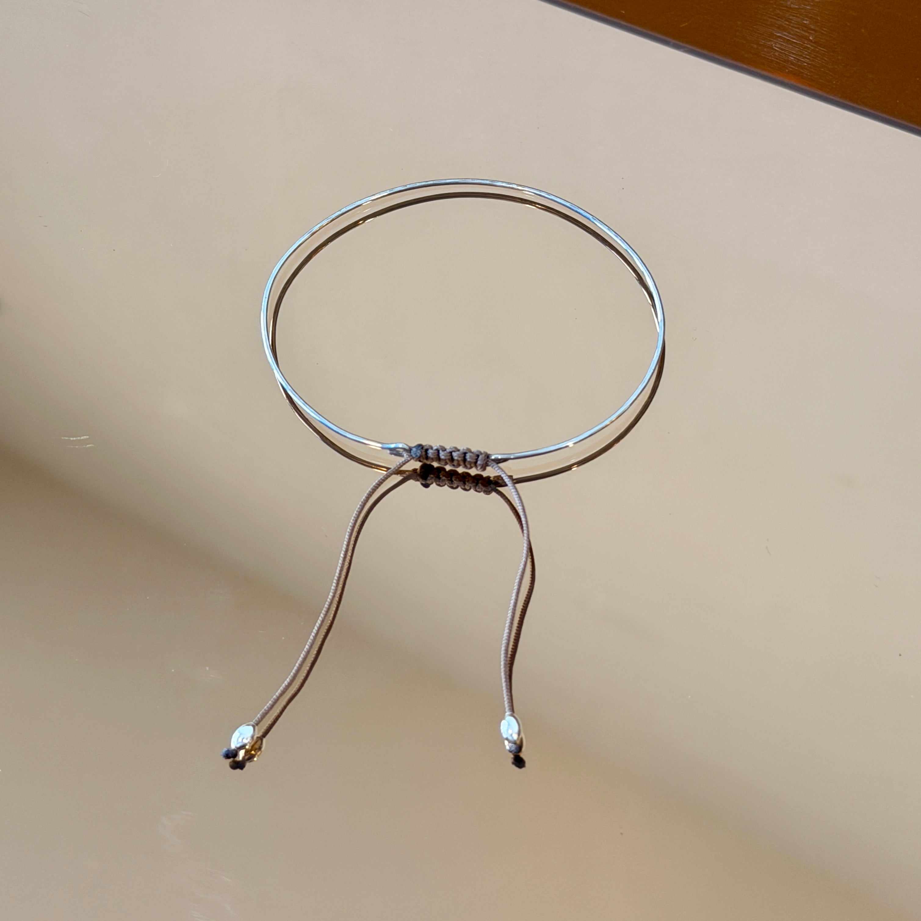 Thin Silver Bracelet with Knotted Accent