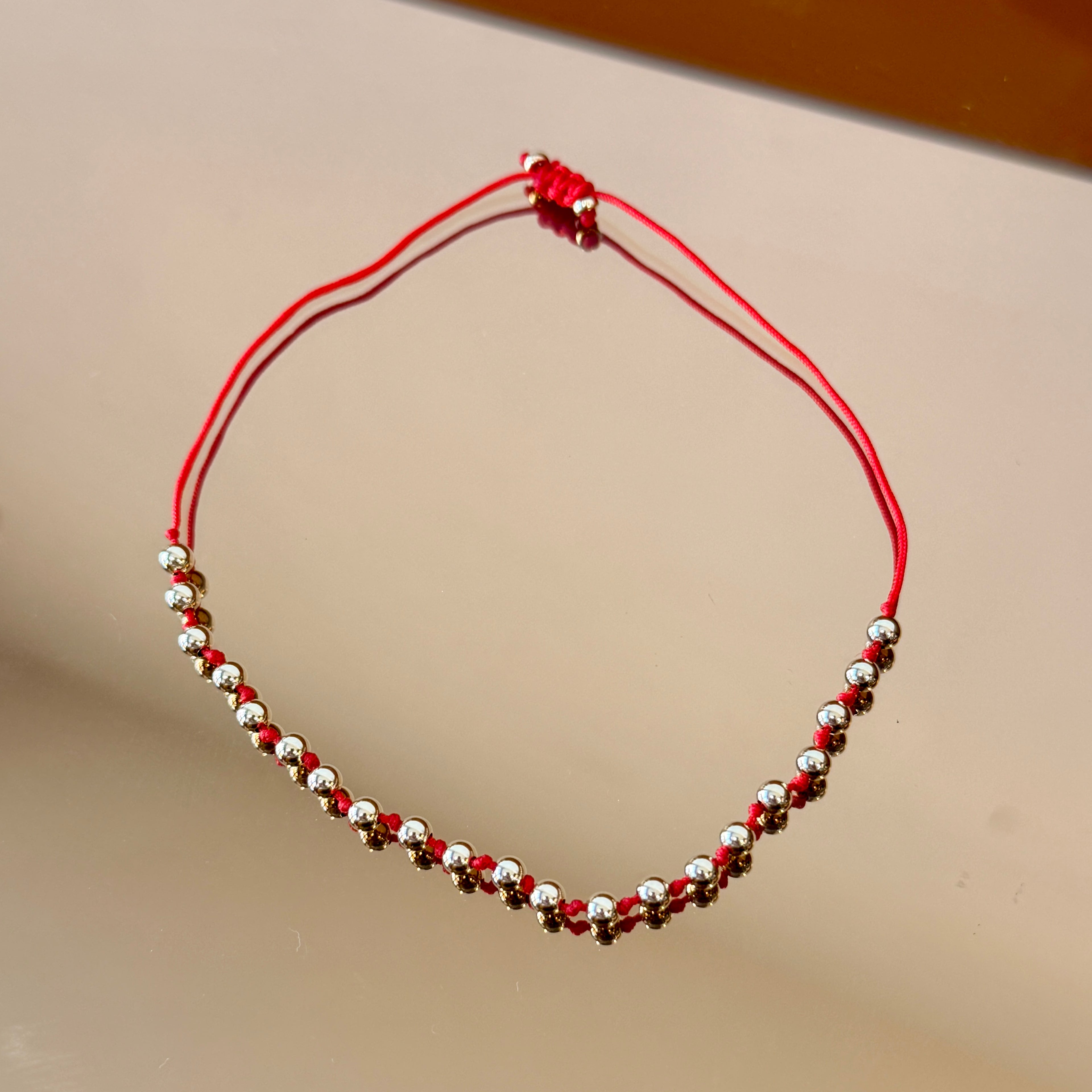 String Bracelet with Gold Accents