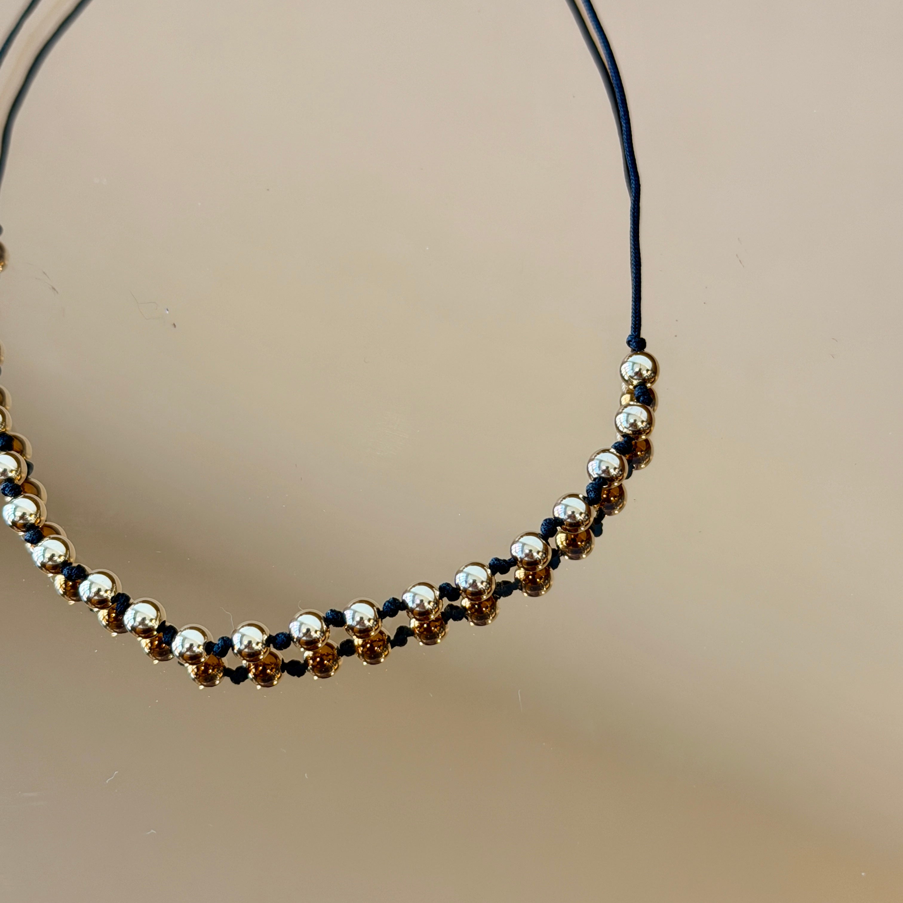 String Bracelet with Gold Accents