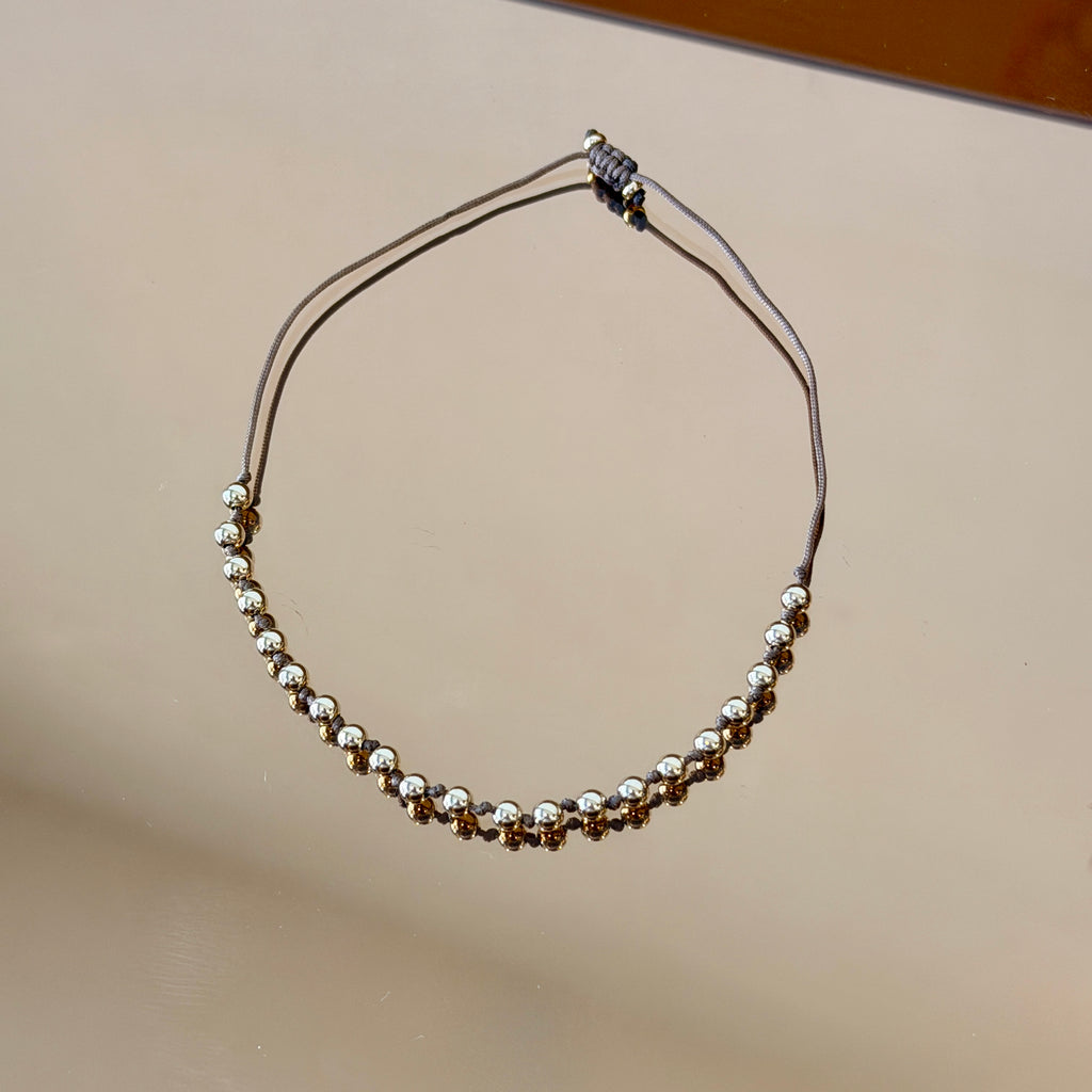 String Bracelet with Gold Accents