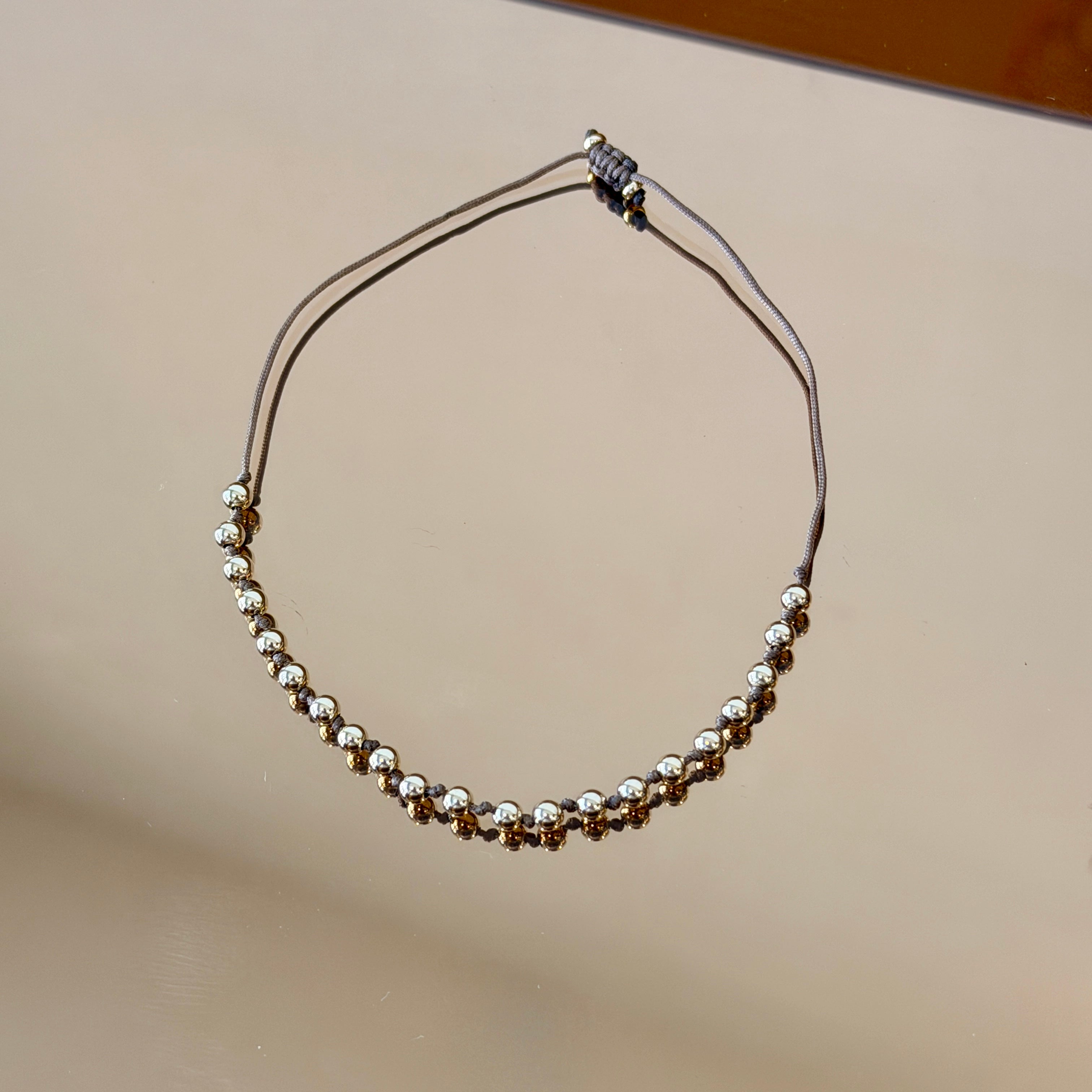 String Bracelet with Gold Accents