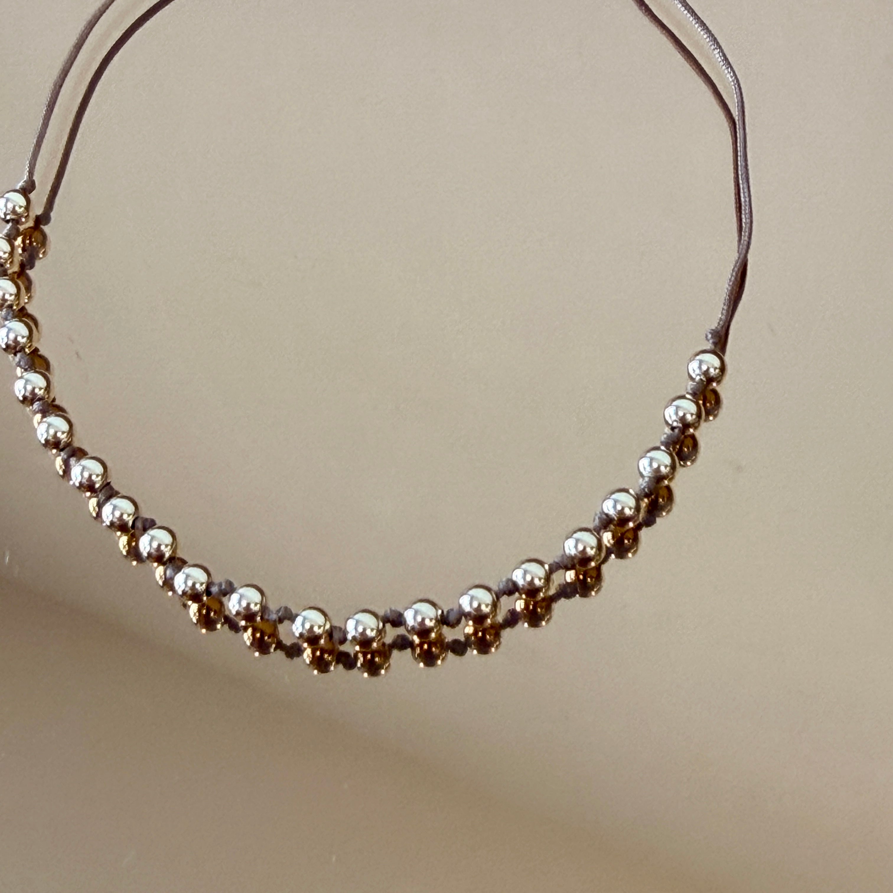 String Bracelet with Gold Accents